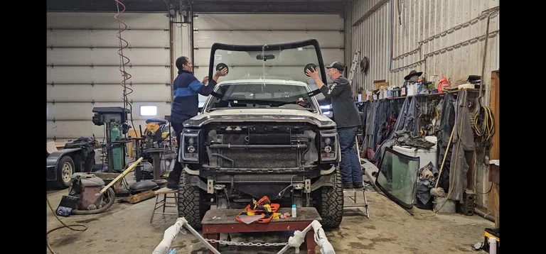 Truck and glass equipment inside a workshop
