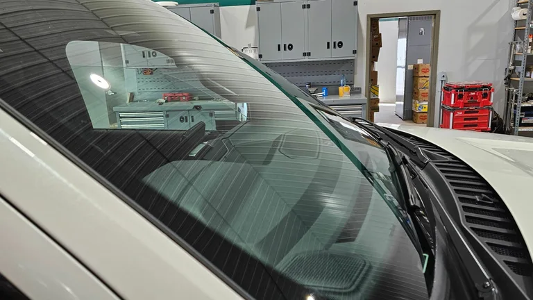 Close-up of a windshield in the workshop