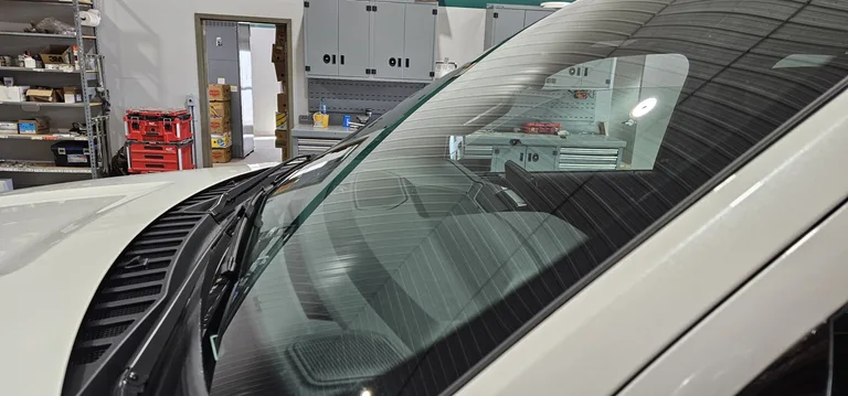 Vehicle windshield inside a repair workshop